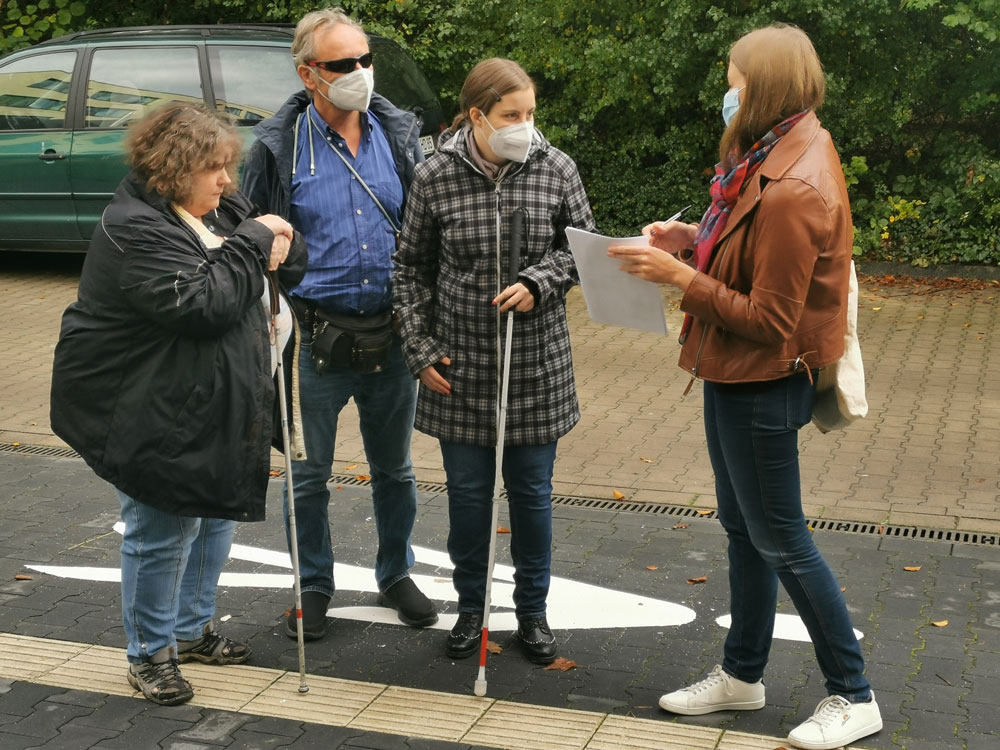 Members of BSBH and Tactile Studio discuss the outdoor podotactile path - © BSBH
